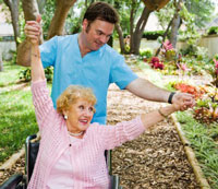 Woman in wheelchair learning new exercises and muscle strengthening activities